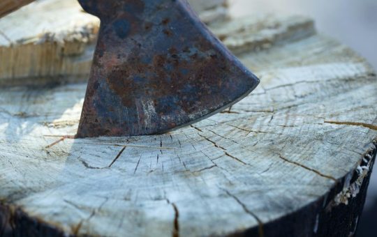 Bybit crypto exchange logo with Rwanda map showing regulatory crypto restriction concept